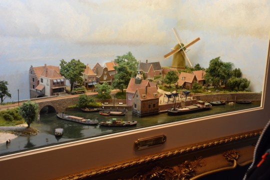 Gezicht op een dorp aan de rivier, Ne